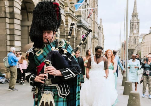 Bagpiper walking the bride to the Ceremony
