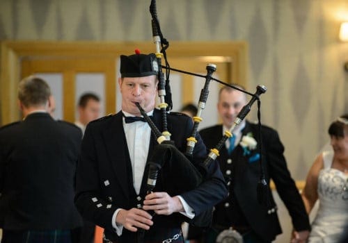 Bagpiper at a wedding - Bride and Groom to the Top Table
