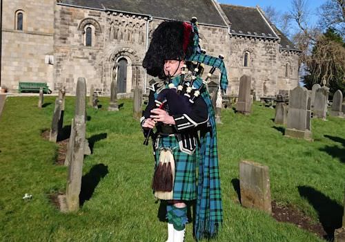 Bagpiper at religious ceremony