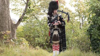 Bagpiper for funeral service card